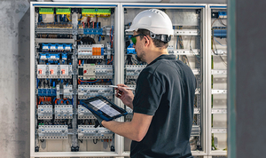 man-electrical-technician-working-switchboard-with-fuses 拷贝.jpg